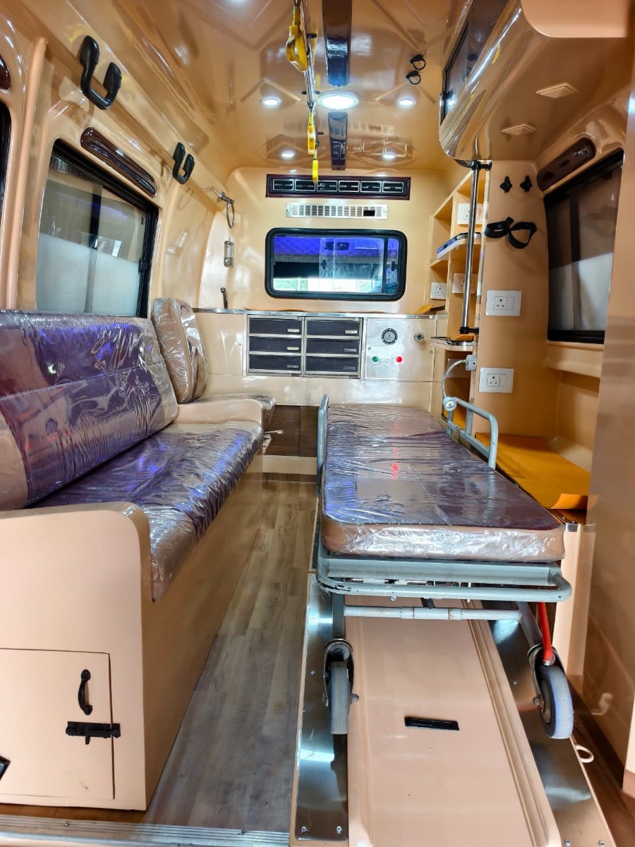 Interior of our mortuary van with stretcher and attendant seating